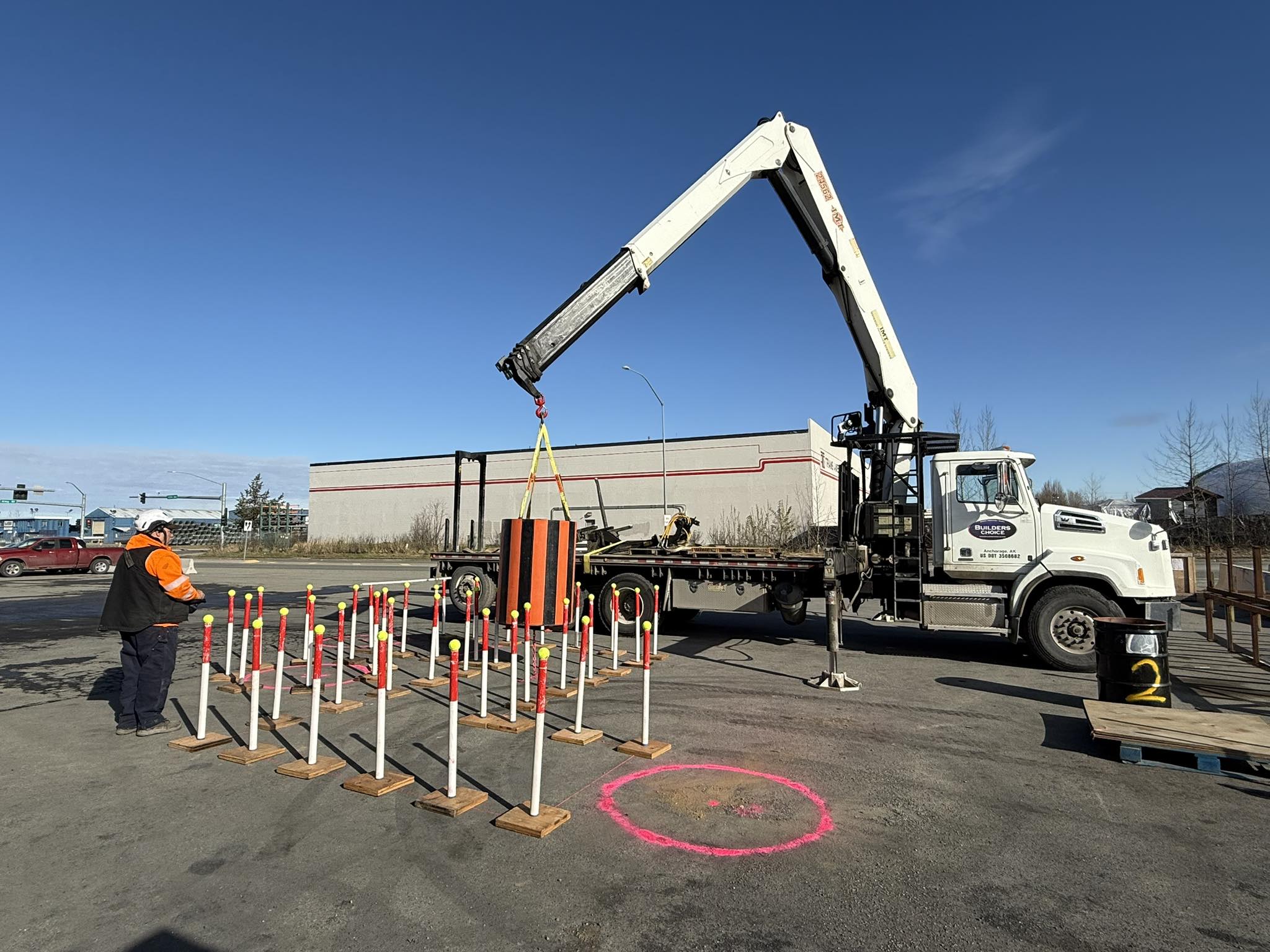 An image of a small crane training to lift around construction cones | crane safety training | Crane Safe LLC