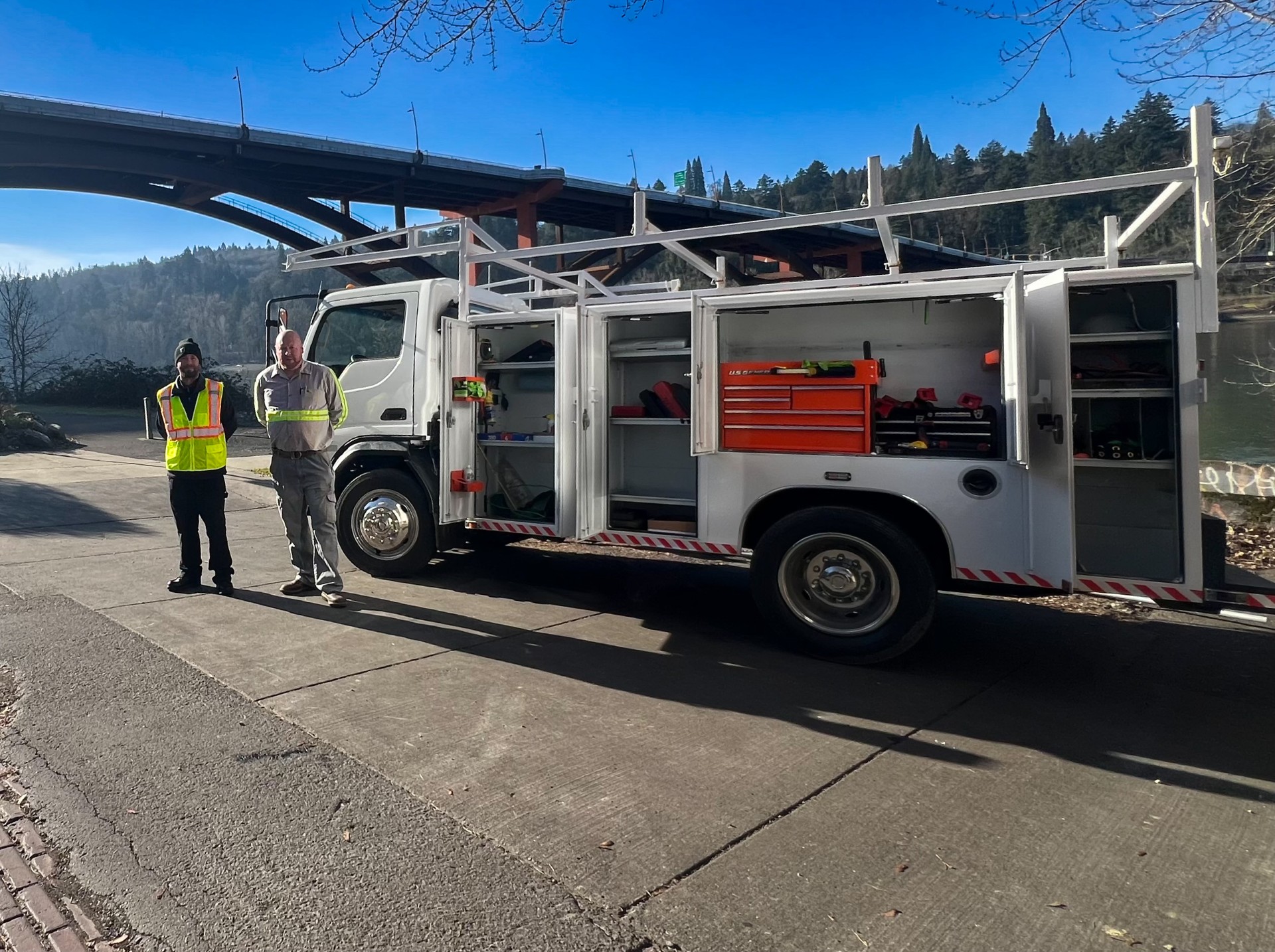 Image of Kevin Williams and a crane operator standing in front of a work truck | Crane Safe LLC
