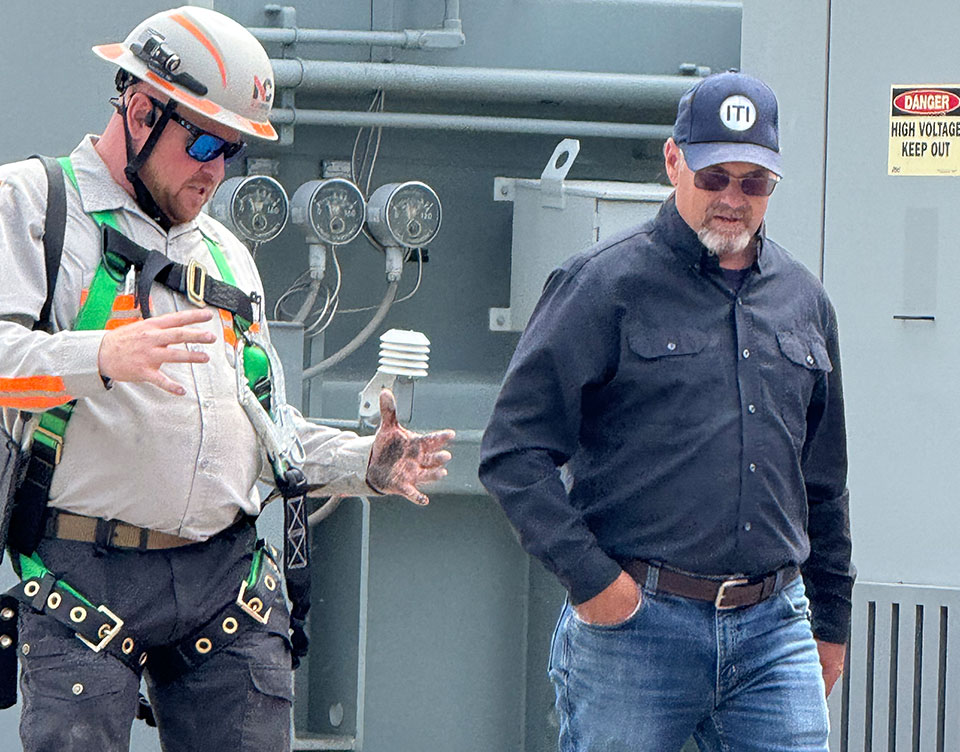 Image of Kevin Williams of Crane Safe instructing on safety with a site manager | Crane Safe LLC